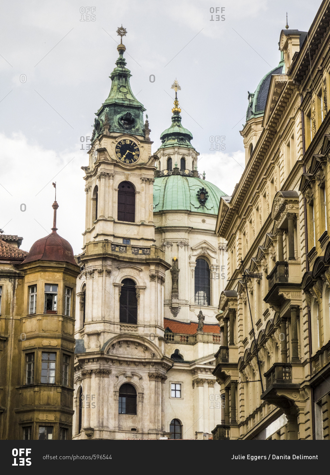 Czech Republic, Prague. St Nicholas Church dome above orange roof tops of Mala Strana