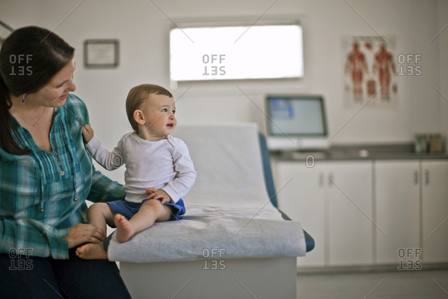 A mother with her baby son at a doctor's appointment