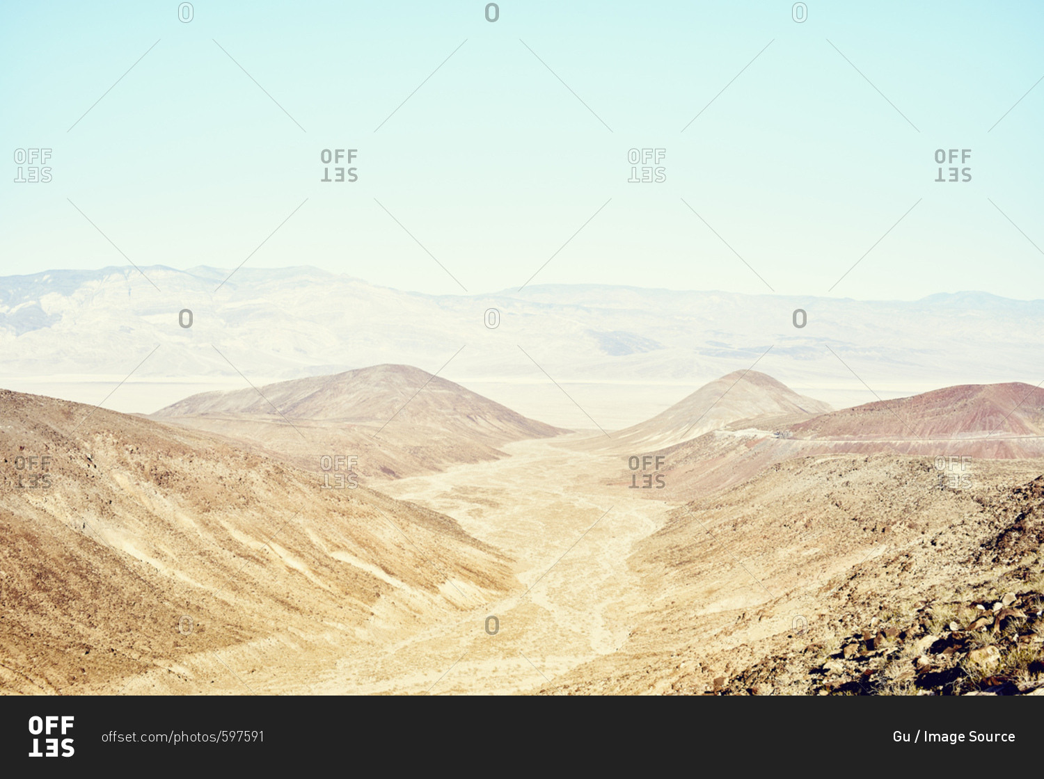 View of valley and distant mountains, Death Valley, California, USA