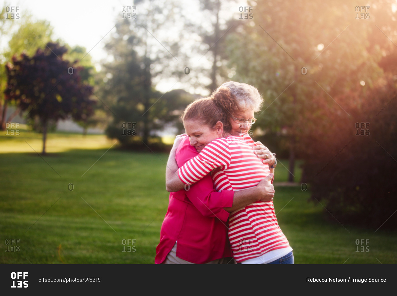 Portrait of mother and adult daughter, hugging