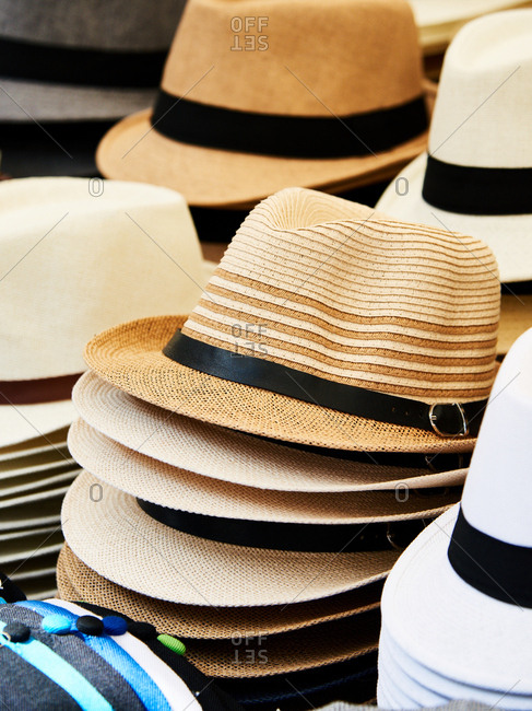 Woven straw hats for sale in market
