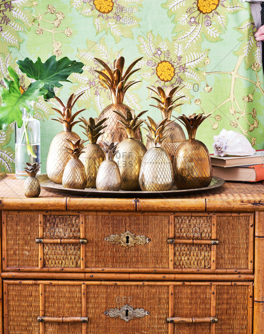 Copper Pineapples On Wicker Dresser Stock Photo Offset