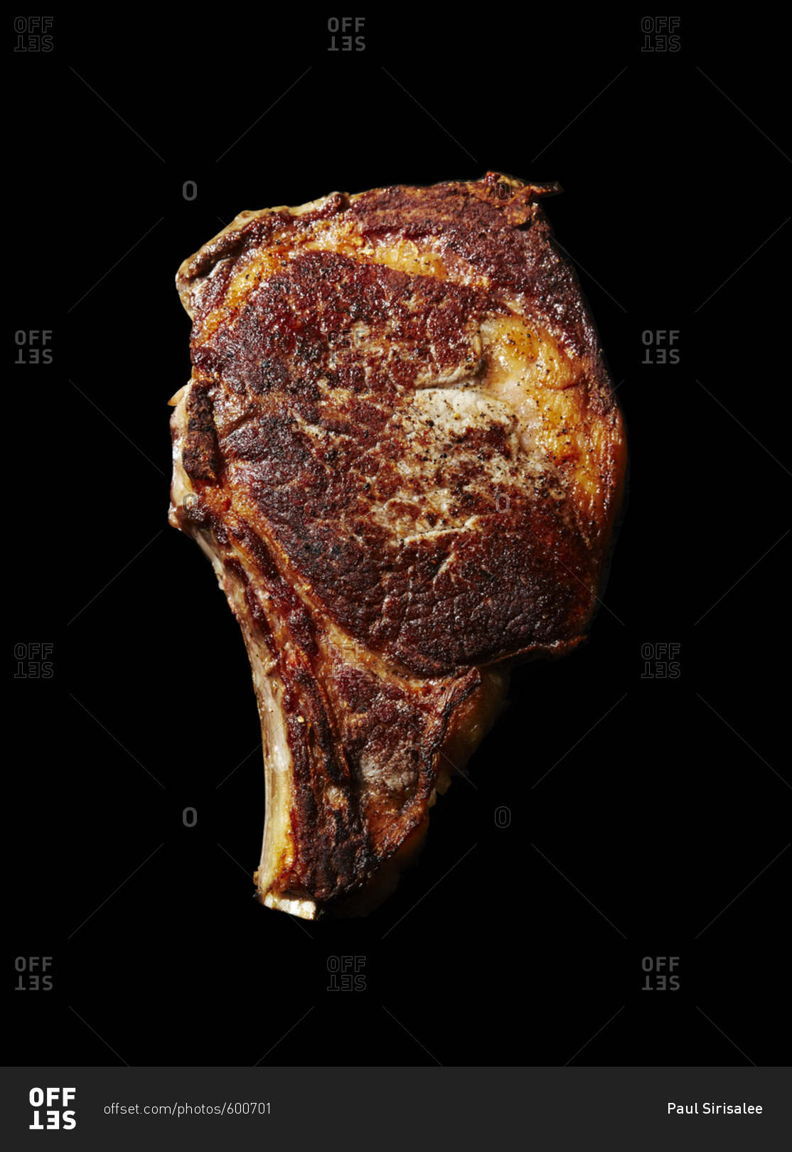 A cooked rib eyed steak