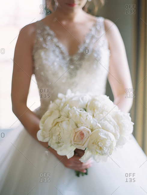 Bride with white rose bouquet