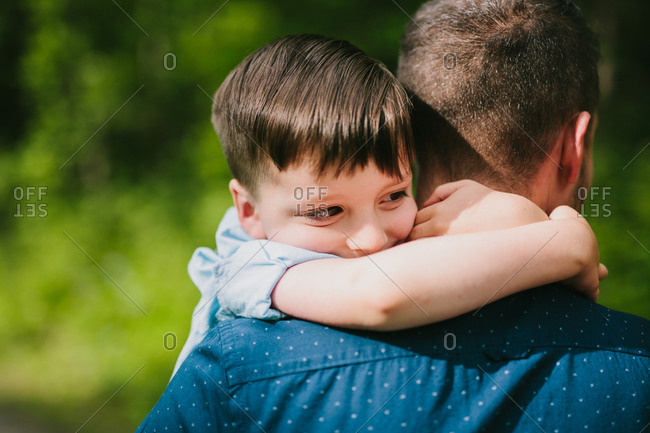 Father And Child Hugging On A Mountain Trail Stock Photo - Offset