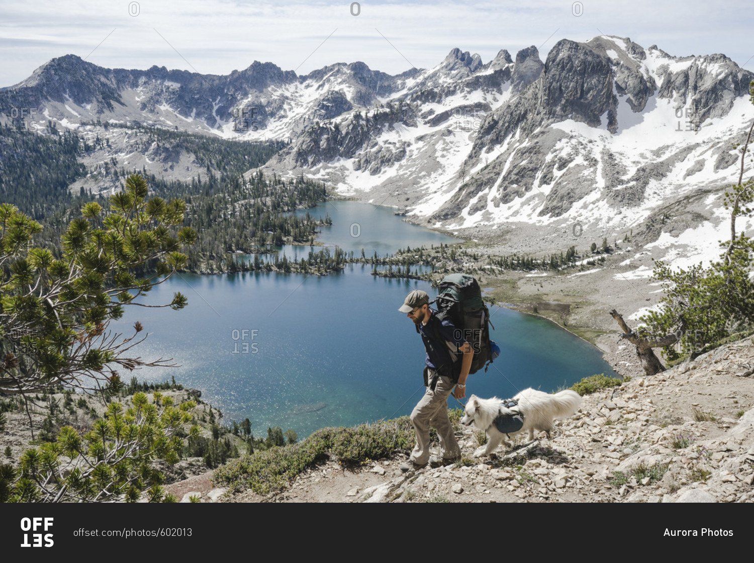 Male backpacker  with dog at Snowyside Pass above Twin Lakes in the Sawtooth Mountains, Idaho