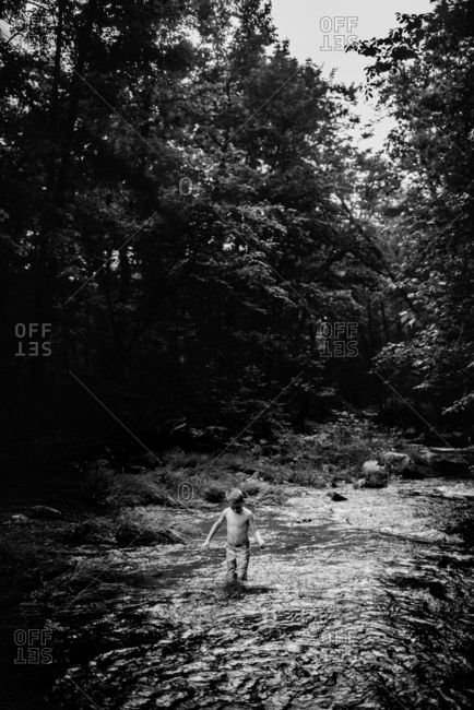 boy swimming in river