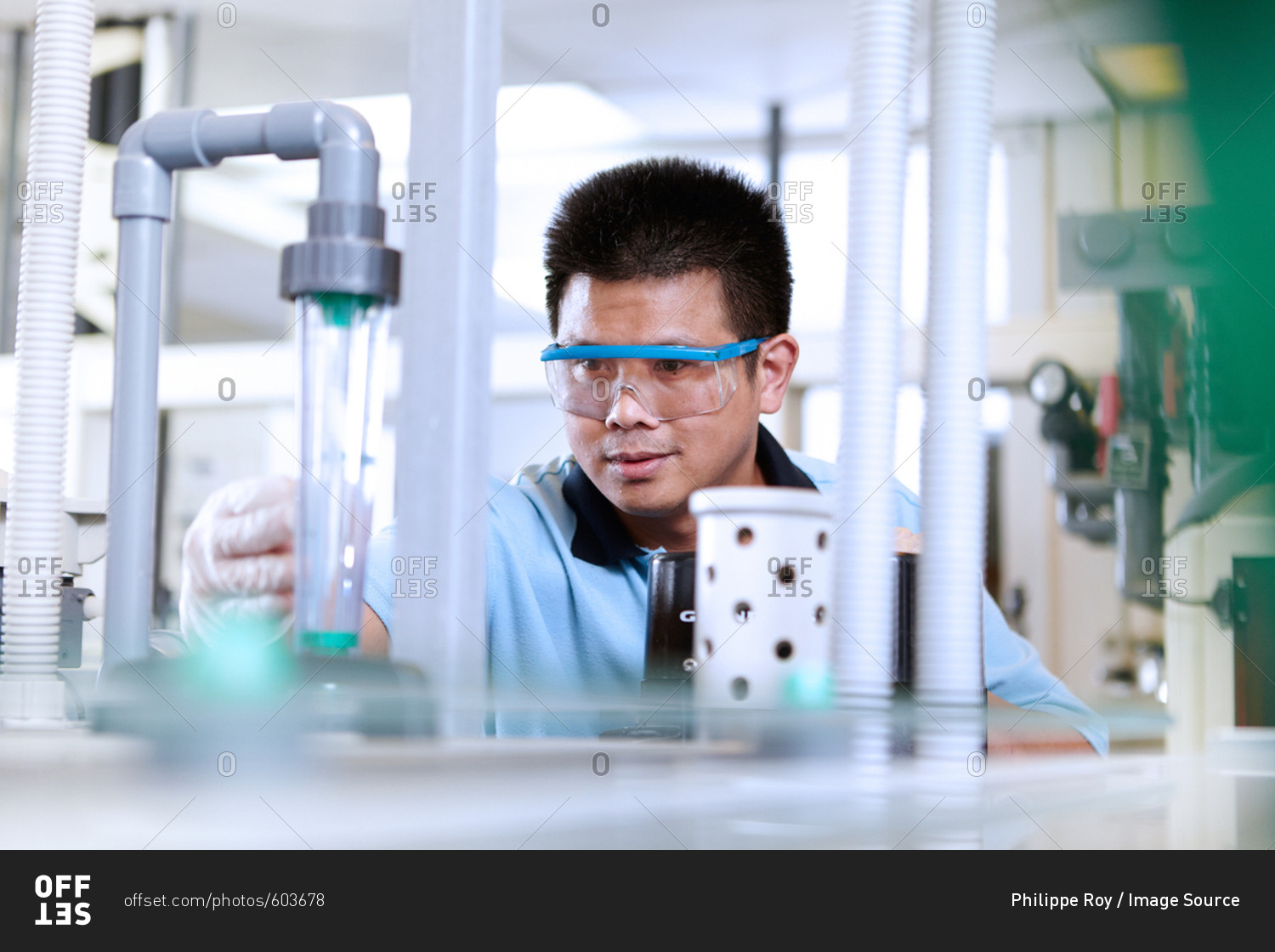 Man wearing safety goggles in flexible electronics plant