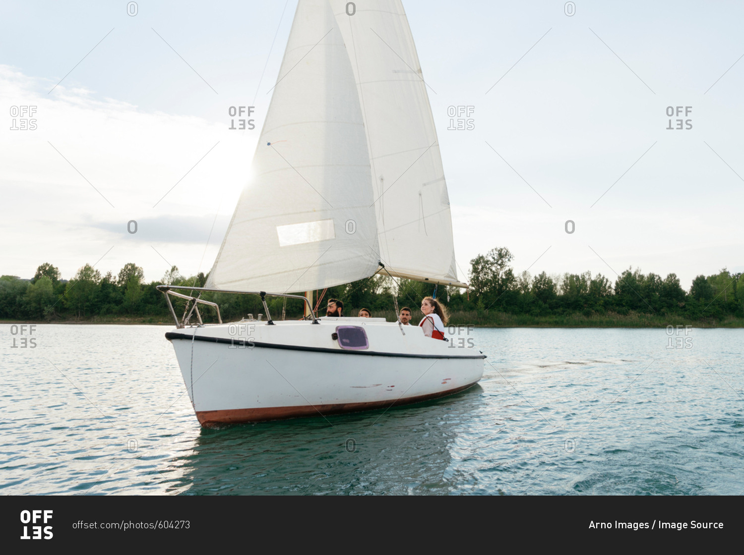 Group of people on sailing boat on lake, Signa, Tuscany, Italy