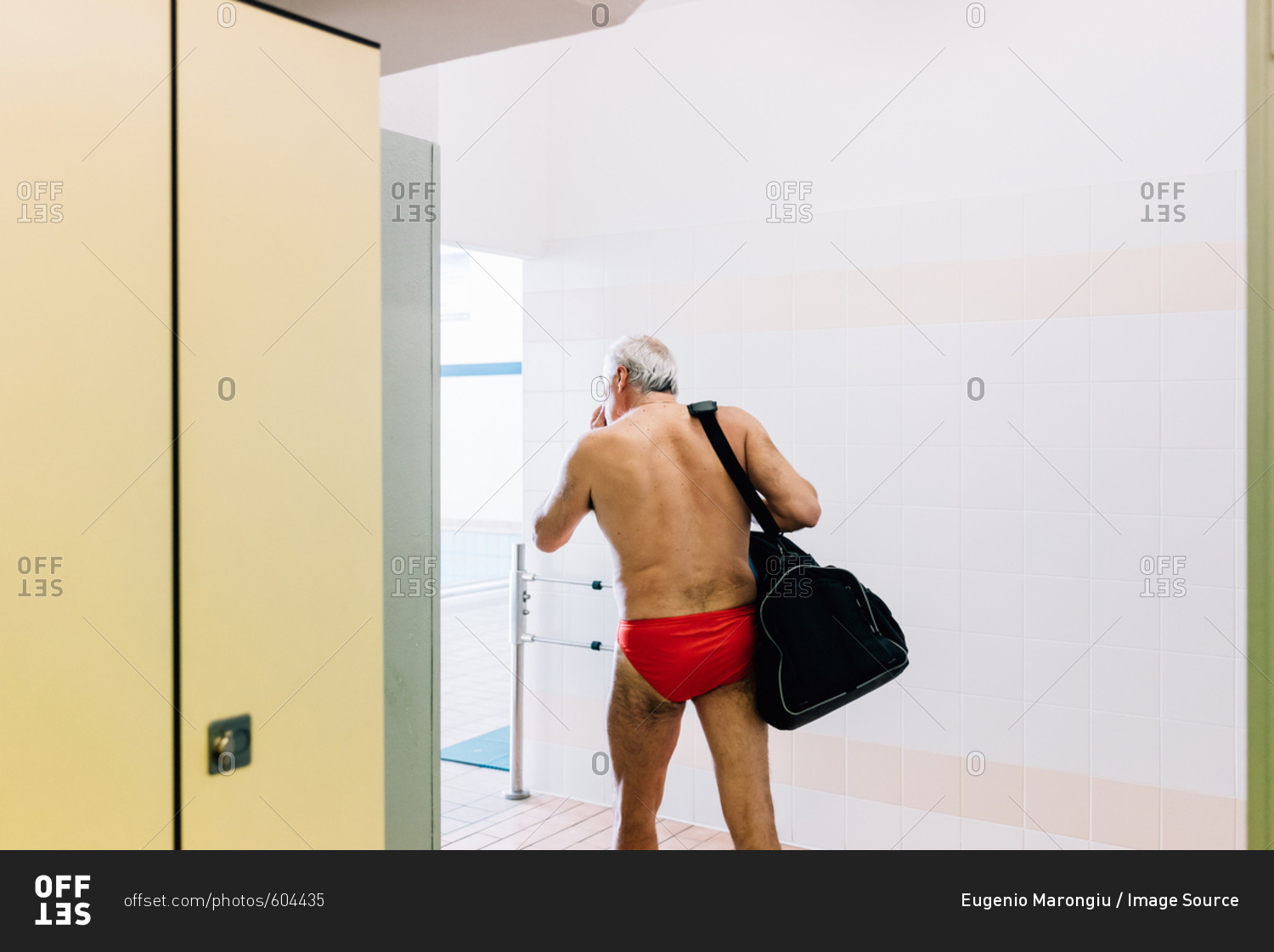 Senior man in locker room of swimming pool