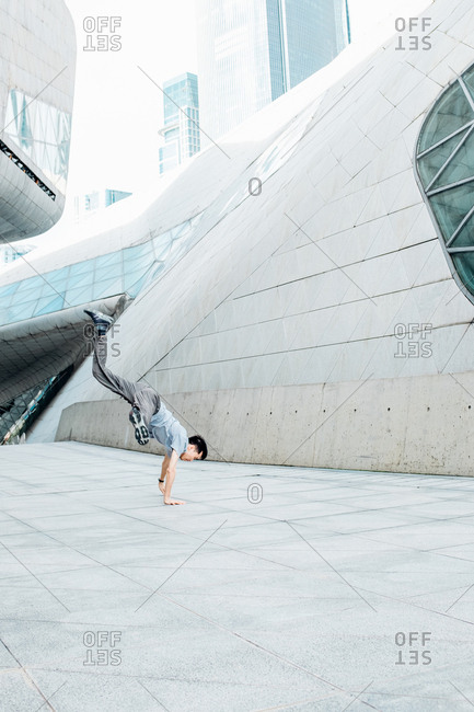 July 11, 2017: Asian man freestyle dance in city street, in Guangzhou, China