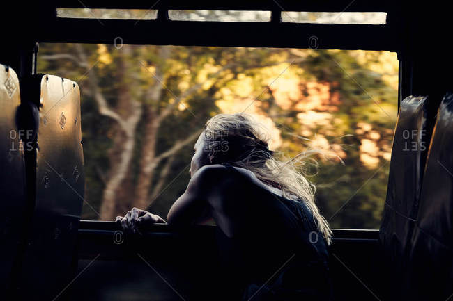 Woman leaning out a train window
