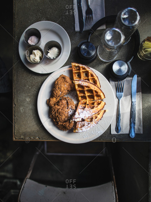 New York, United States of America - April 8, 2017: Unusual breakfast combination with fried chicken and waffle at Nas and John Seymour�s �Sweet Chick� Restaurant. The new trend is a savory-and-sweet combo, which is a must try when coming to New York