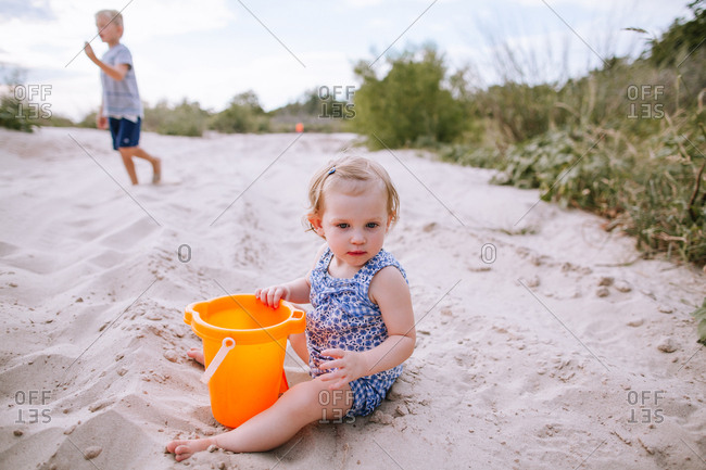 A girl playing on a beach