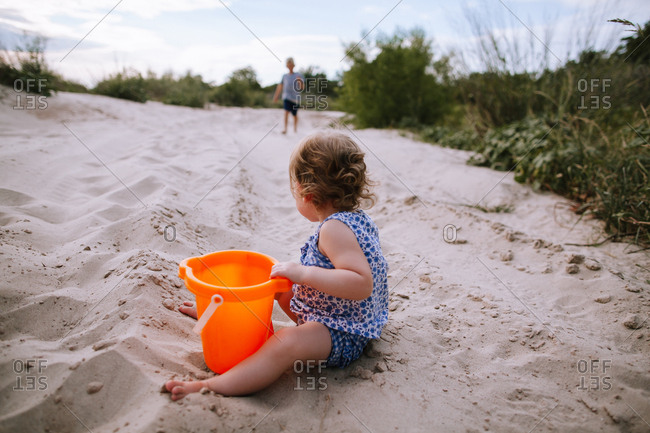 A girl playing on a beach