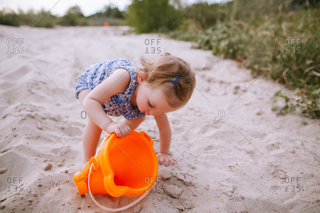 A girl playing on a beach