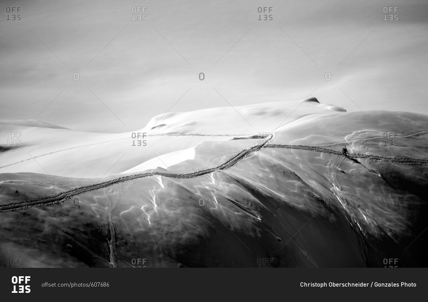 Austria, Arlberg - February 22, 2014: A breathtaking view on the Arlberg where a skier is fighting his way through the deep snow. The mountain range is located between Vorarlberg and Tyrol
