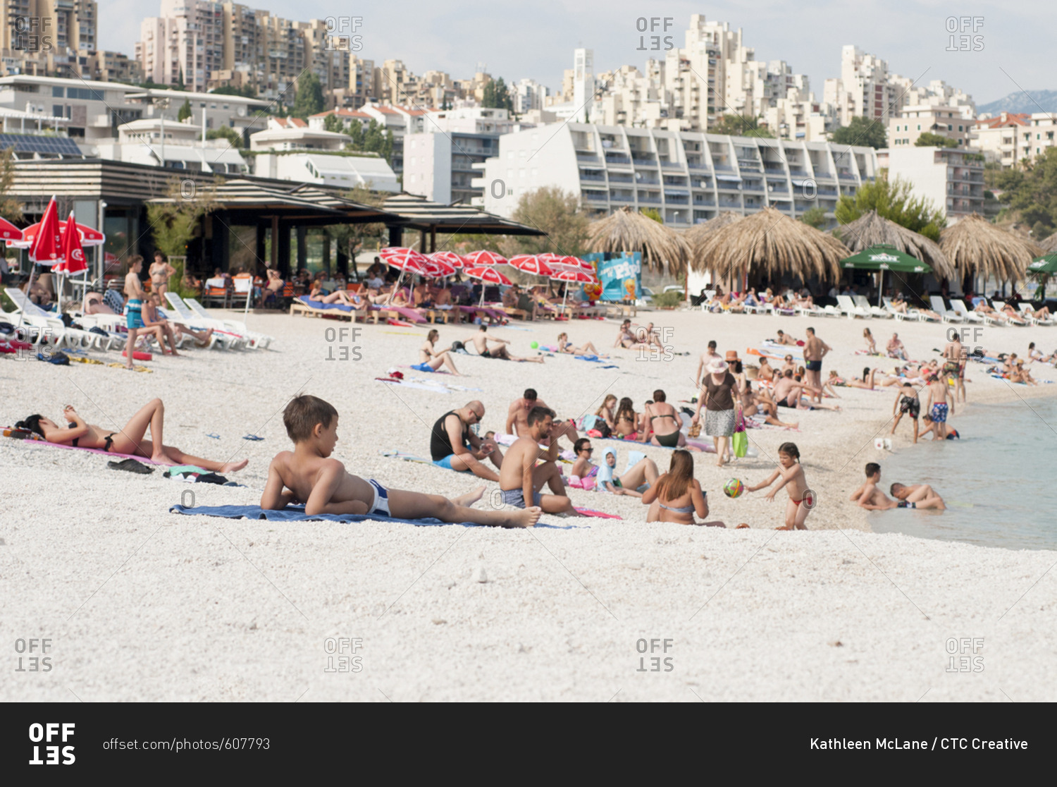 Split, Croatia - June 7, 2017: People sit on the beach in Split