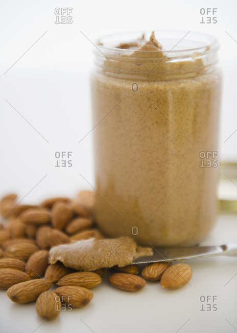 Close up almond butter and almonds