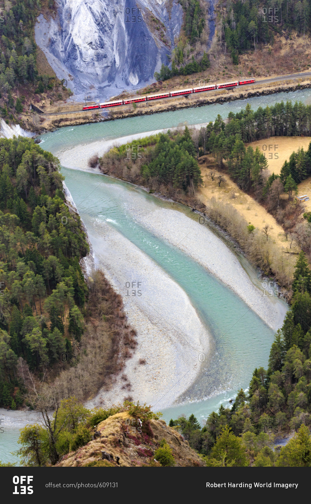 The Red Train travels along the Rhine River, Rhein Gorge (Ruinaulta), Flims, Imboden, Graubunden, Switzerland, Europe