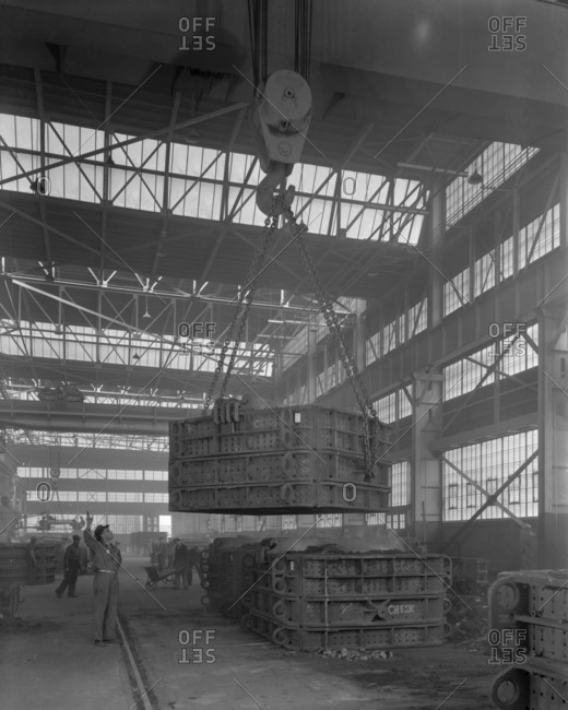 Chicago, IL, USA - April 28, 1943: Crane hoists to lift large steel objects at American Steel Foundries plant in East Chicago