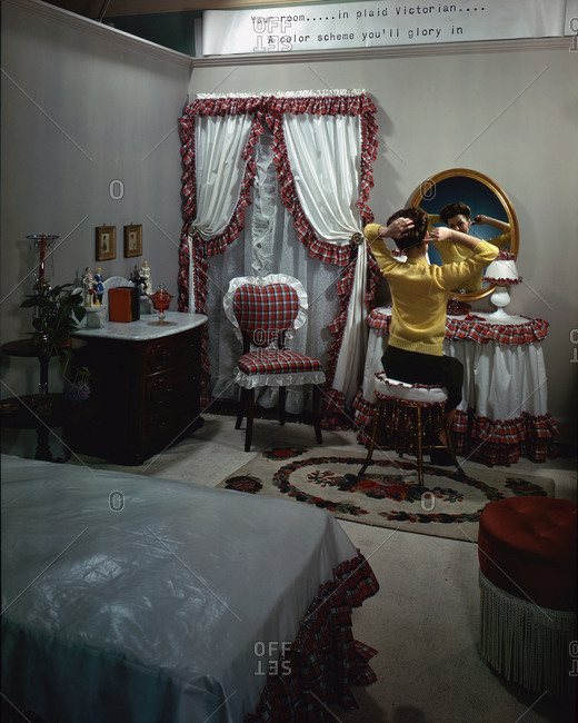 Chicago, IL, USA - December 8, 1943: Bedroom furniture with model at her vanity table at Marshall Field