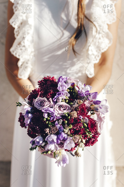 Italian bride holding her bridal bouquet