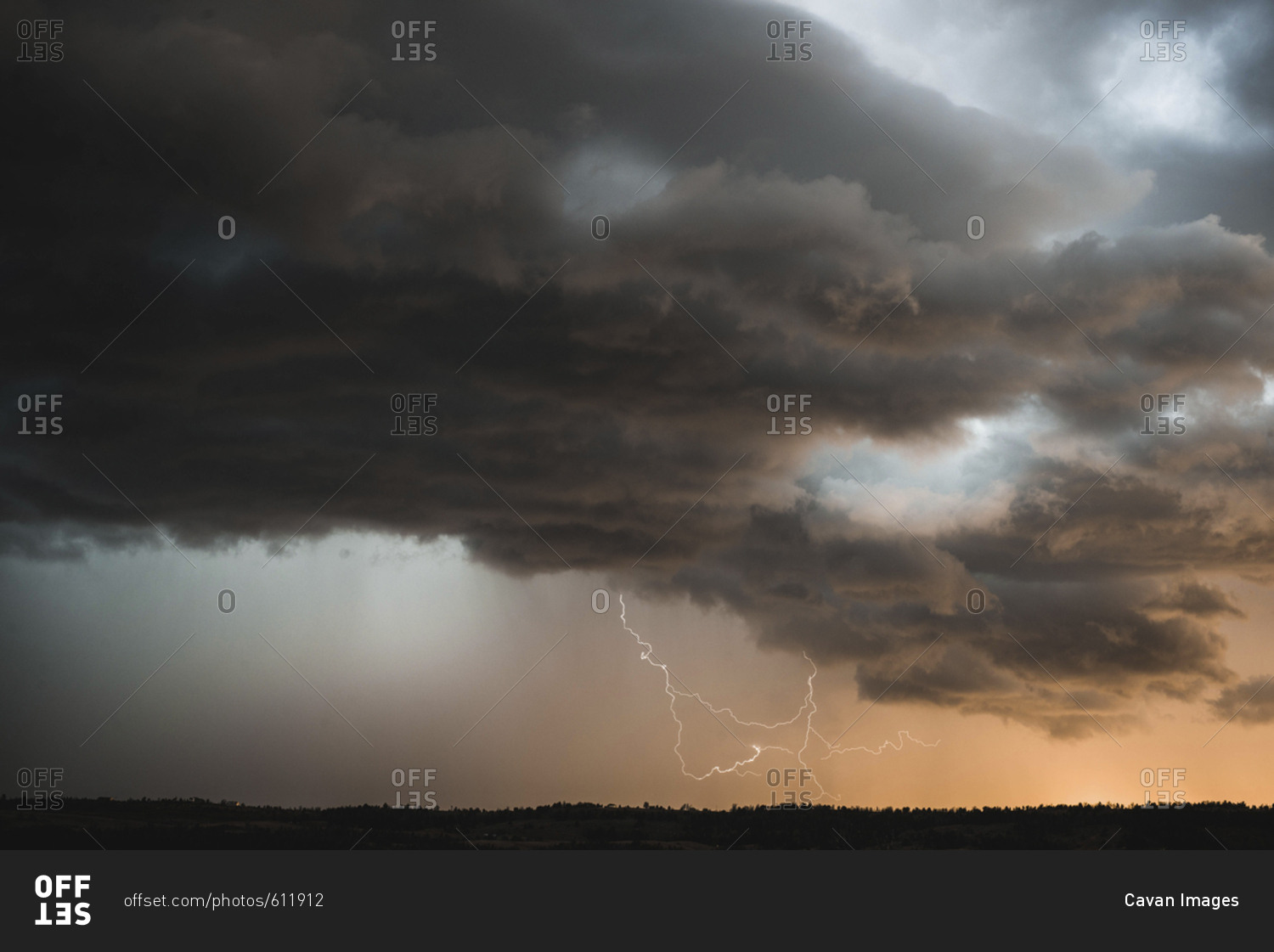 Scenic view of thunderstorm clouds over landscape