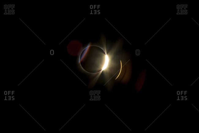 Low angle view of solar eclipse against clear sky