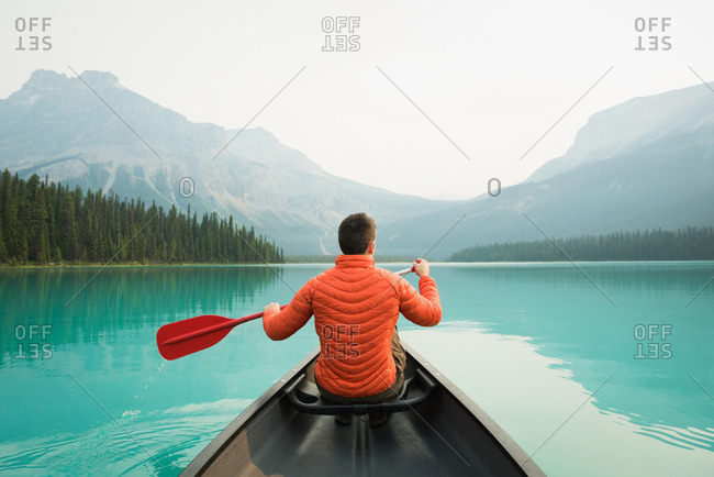 Man kayaking in lake