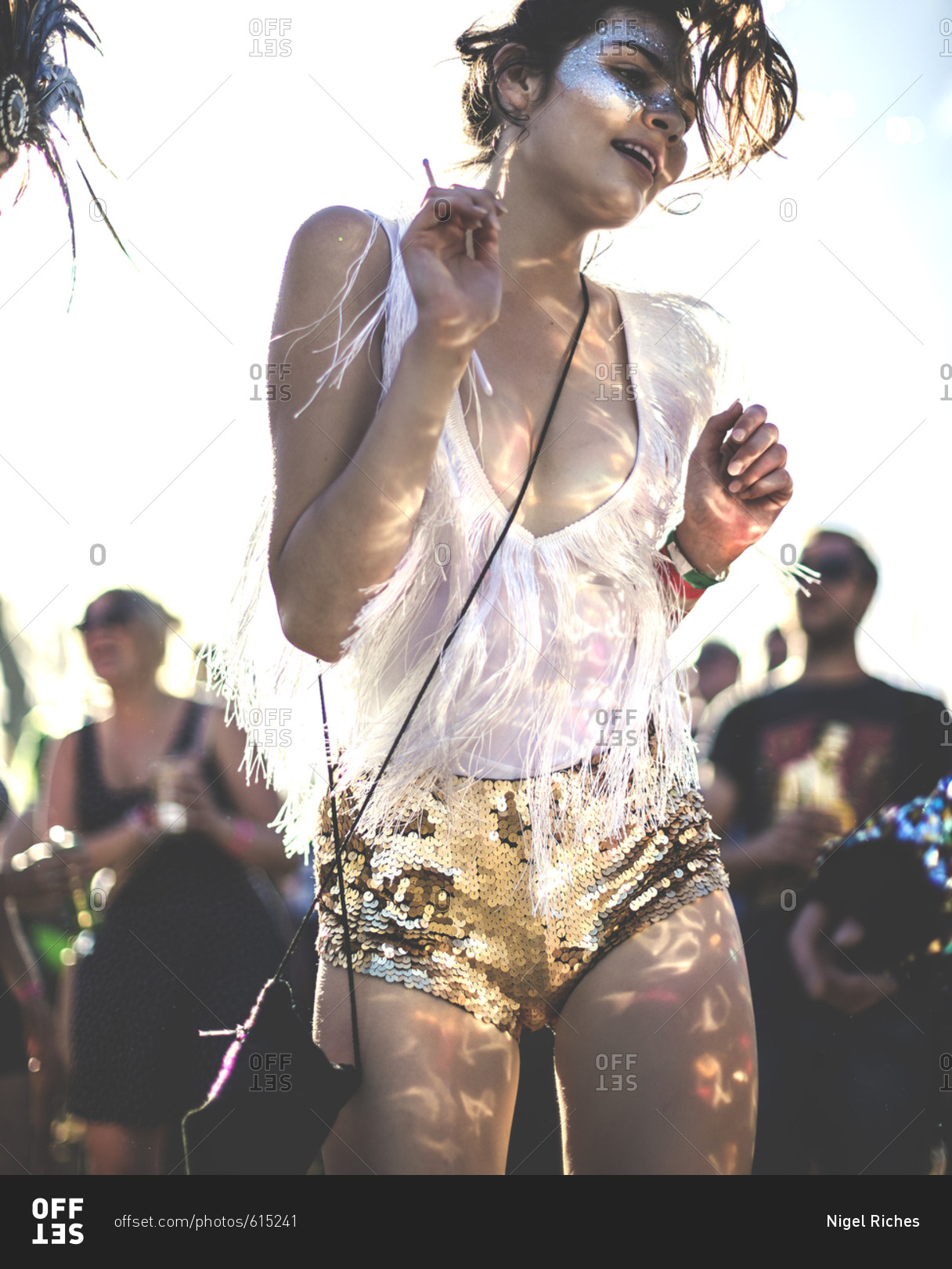 Brunette woman dancing at a music festival