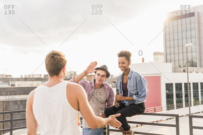 Friends meeting on a rooftop party