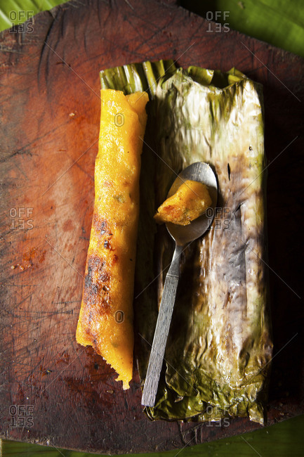 Charred Ecuadorian corn cake tamale with spoon