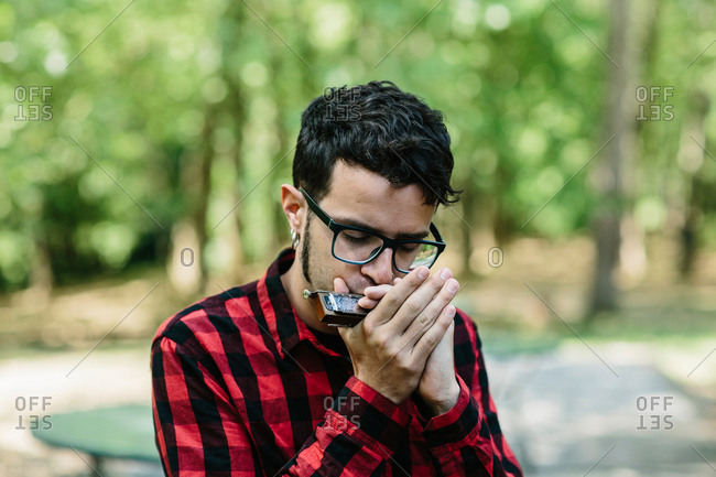 Man playing mouth organ