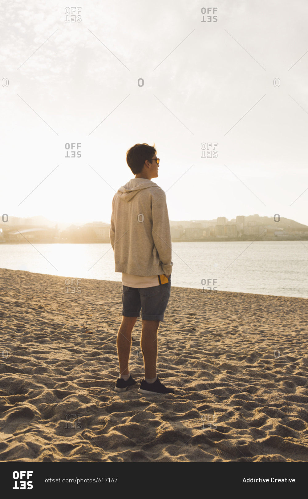 Man posing on beach - Offset stock photo - OFFSET