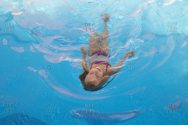 Child swimming in pool