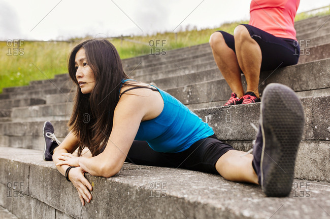 Woman doing split on steps