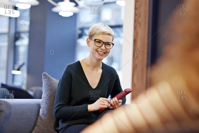 Smiling young woman in office