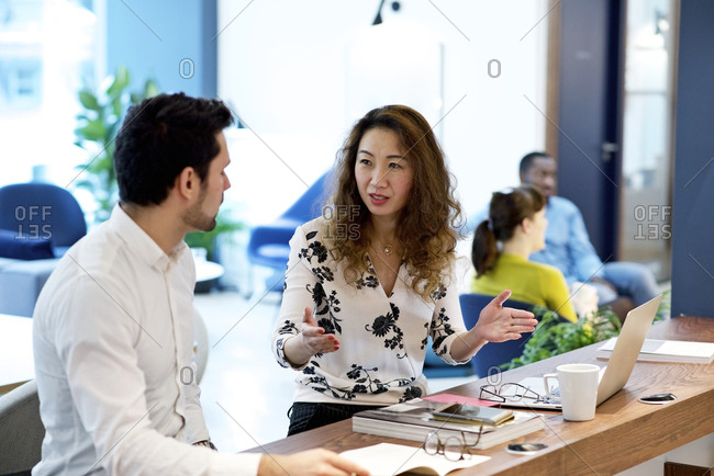 Two coworkers having a discussion