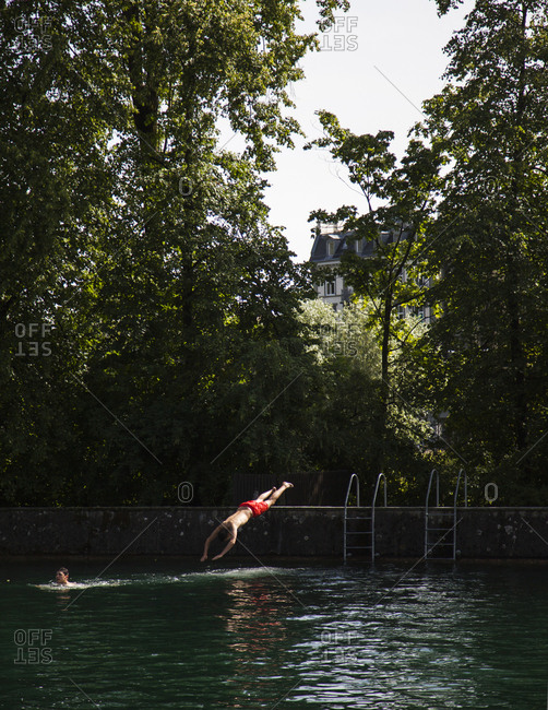 Zurich, Switzerland June 7, 2014 Man diving into the Limmat River