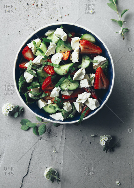 Colorful cucumber and strawberries salad