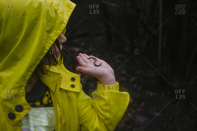 Girl holding worm in her hand