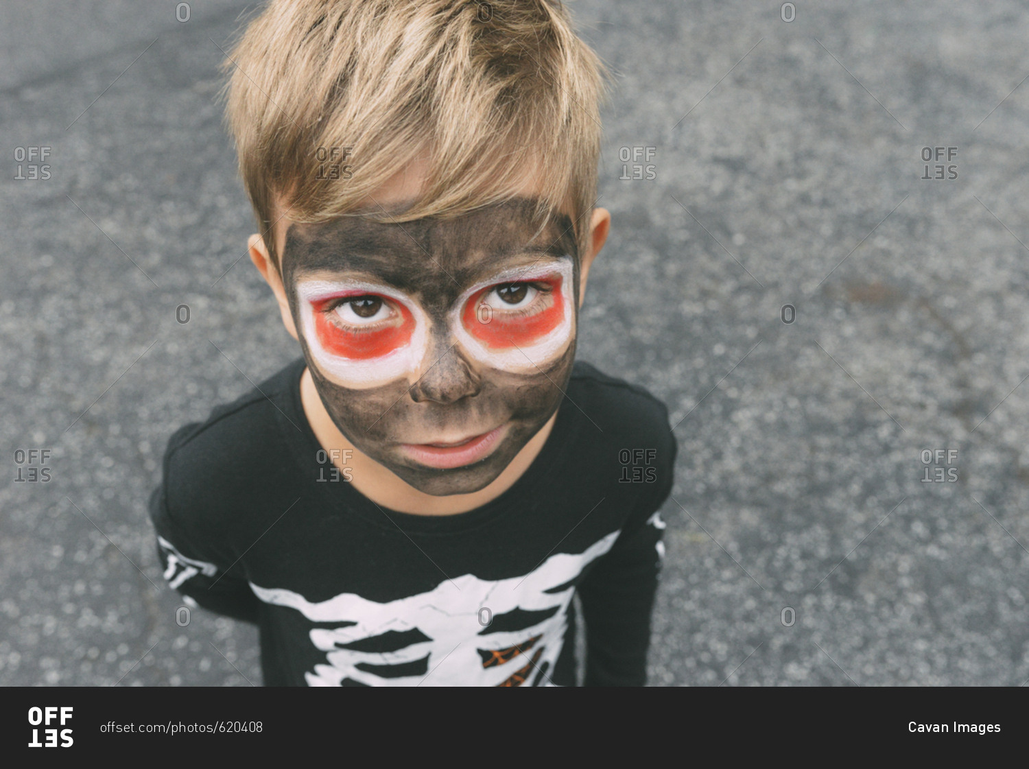 High angle portrait of boy with face paint during Halloween