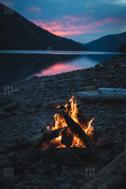 Campfire near lakeside at night