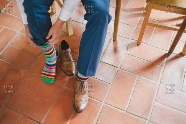 Man dresses in striped socks