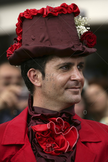 May 29, 2015: A man in a flowery hat at the Madeira Flower Festival Parade, Funchal, Madeira, Portugal