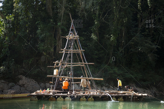 January 17, 2014: A drill rig collects core samples in a natural constriction of the Nam Ou River where Dam #7 is planned for construction, within Phou Den Din National Protected Area, Laos (despite Sino Hydro's charter not to impact country's national parks with their hydropower development).