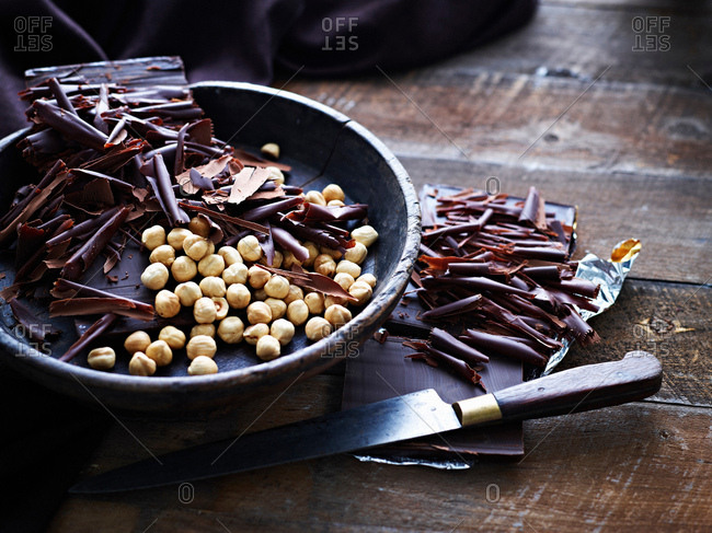 Chocolate shavings and hazelnuts in bowl