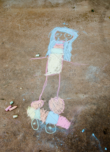 Child's chalk drawing of a person on a skateboard