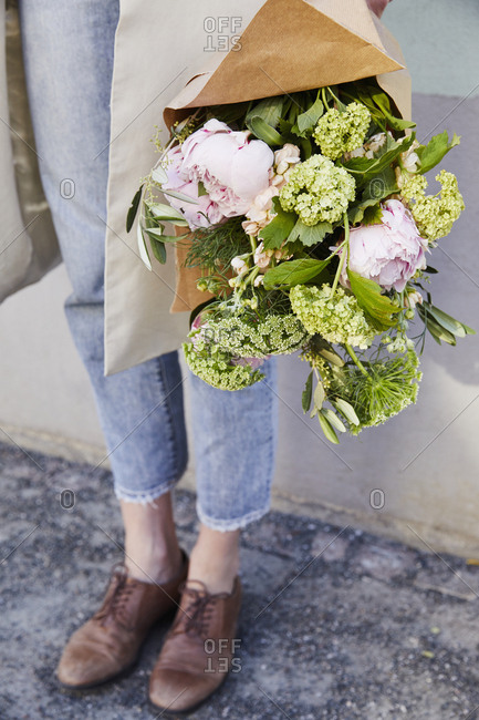 Woman holding flowers - Offset Collection